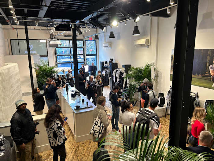 Guests explore the PXG Clubhouse pop-up in SoHo, New York.